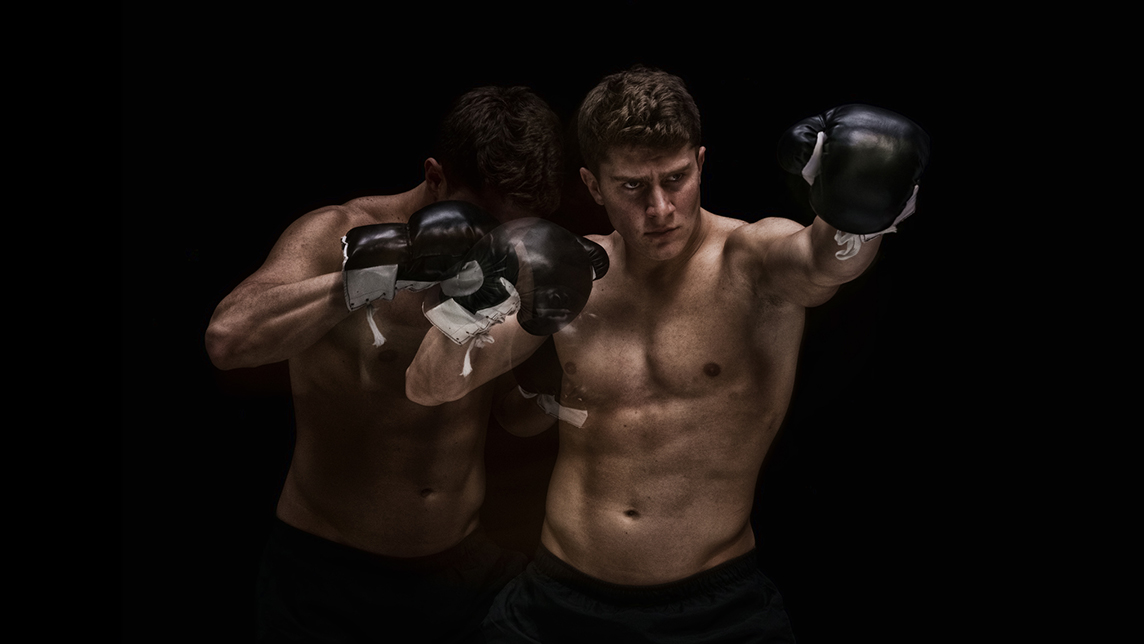 Action shot of two UFC fighters.