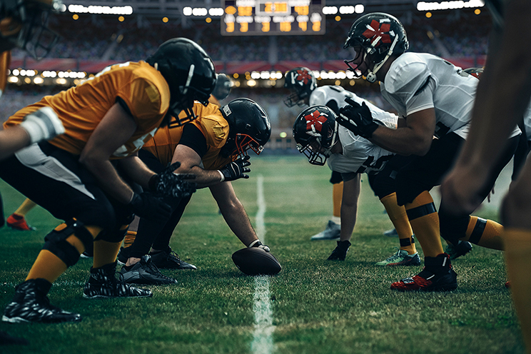 Football players lined up to hike the ball
