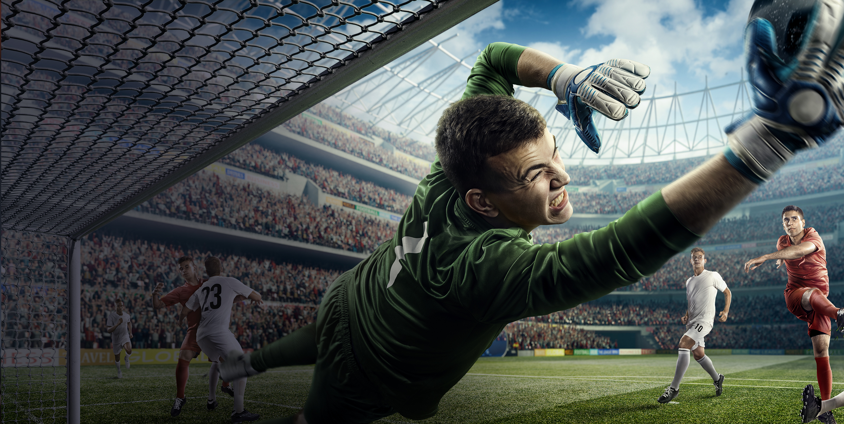 Goal keeper blocking shot at full stretch