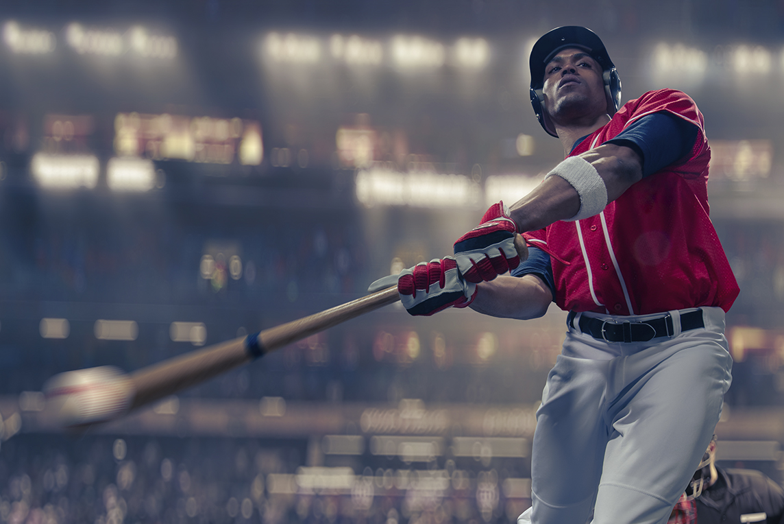baseball player hitting the ball