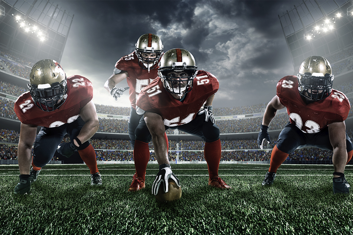 Football players lined up in formation on the field