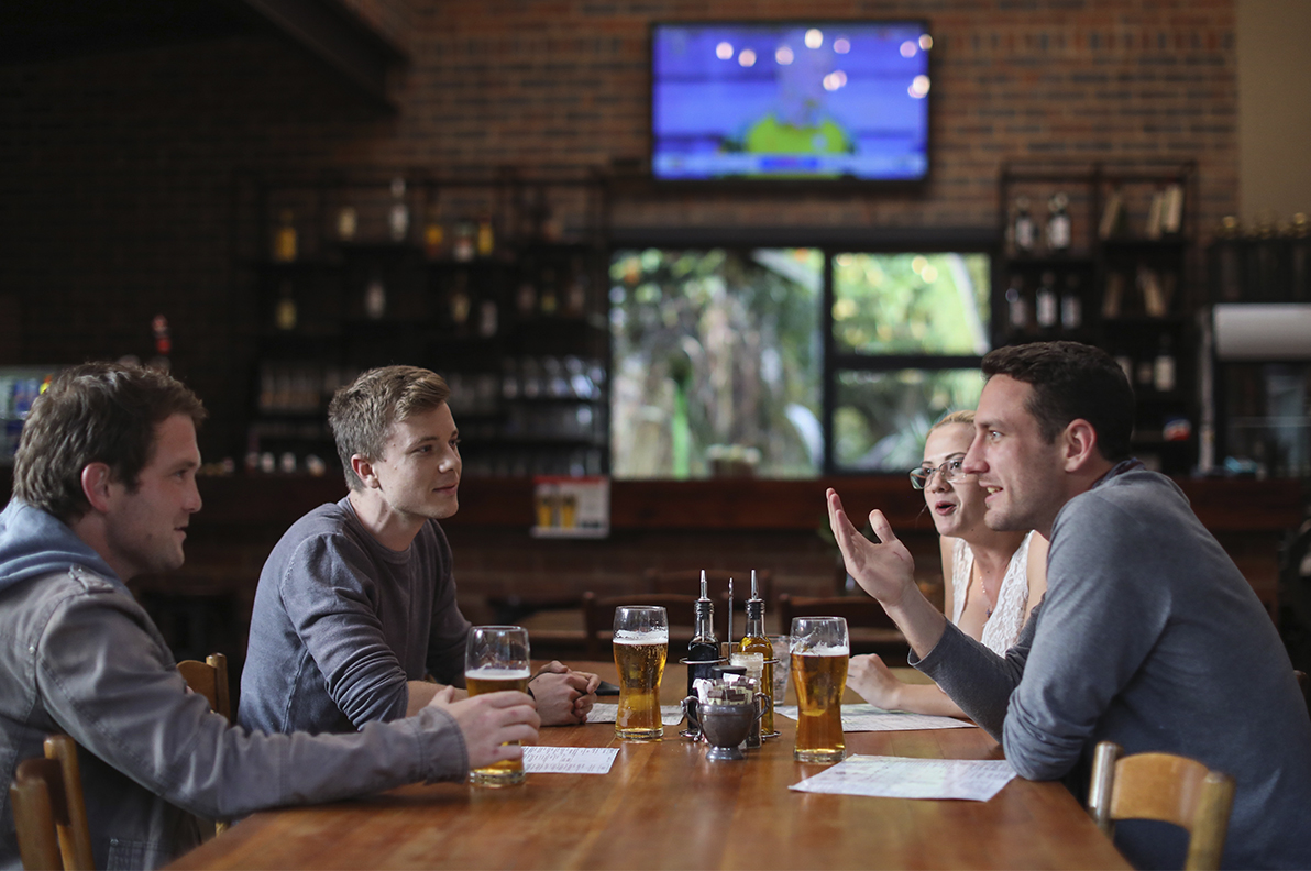 Friends sitting at table in a restaurant