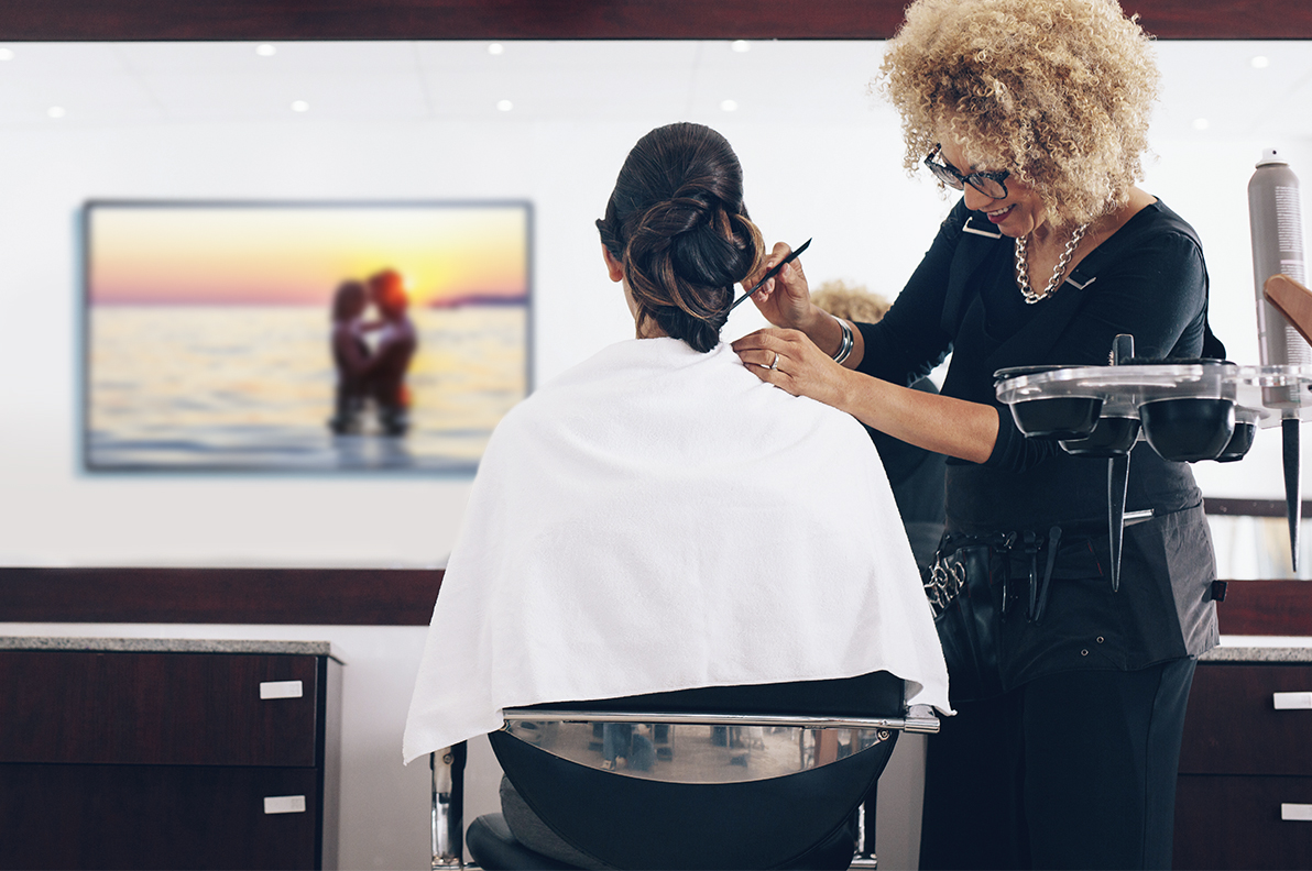 Woman getting a haircut at the salon